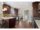 Modern kitchen with dark cabinetry, granite countertops, and stainless steel appliances at 3311 N York St, Denver, CO 80205