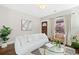 Inviting living room with a comfortable white sofa and bright natural light at 3311 N York St, Denver, CO 80205