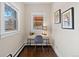 Bright home office offers a comfortable workspace with natural light and hardwood floors at 3311 N York St, Denver, CO 80205