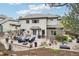 Backyard featuring a stone patio with comfortable seating, perfect for outdoor enjoyment and relaxation at 1474 S Uinta Ct, Denver, CO 80231
