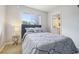 Comfortable bedroom with a well-lit window and easy access to the en suite bathroom at 1474 S Uinta Ct, Denver, CO 80231