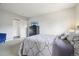 Spacious bedroom features a comfortable bed and easy access to other rooms in the house at 1474 S Uinta Ct, Denver, CO 80231