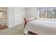 Bedroom showcasing a natural light, a closet and access to an adjacent room at 1474 S Uinta Ct, Denver, CO 80231