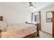 Bright bedroom featuring a wooden bed frame, a ceiling fan, and a window with natural light at 1474 S Uinta Ct, Denver, CO 80231