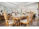 Spacious dining room with chandelier, table and chairs with views of the kitchen at 1474 S Uinta Ct, Denver, CO 80231