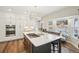 Stylish kitchen with an island, stainless steel appliances, and a cozy bay window at 1474 S Uinta Ct, Denver, CO 80231
