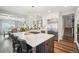 Bright, open kitchen features an island, stainless steel appliances, and hardwood floors at 1474 S Uinta Ct, Denver, CO 80231