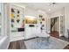 Cozy living room featuring built-in shelving, a TV, and a stylish rug at 1474 S Uinta Ct, Denver, CO 80231