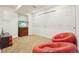 Casual rec room with comfortable seating, a TV, and a spacious closet for storage at 1474 S Uinta Ct, Denver, CO 80231