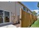 Fenced backyard with sliding door access, offering privacy and outdoor enjoyment at 8905 Field St # 91, Westminster, CO 80021