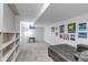 Finished basement with cozy seating and a variety of colorful wall art at 8905 Field St # 91, Westminster, CO 80021