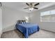 Cozy bedroom featuring a ceiling fan, plush carpet, and a comfortable bed with stylish pillows at 8905 Field St # 91, Westminster, CO 80021