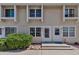 Inviting townhome featuring neutral siding, white trim, updated windows, and well-maintained landscaping at 8905 Field St # 91, Westminster, CO 80021