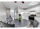 Eat in kitchen featuring stainless appliances, a dining area, and a staircase at 8905 Field St # 91, Westminster, CO 80021