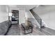 Comfortable living room showcasing wood floors, contemporary decor, and a staircase at 8905 Field St # 91, Westminster, CO 80021