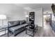 Bright living room with sleek furniture and a view leading to the dining area at 8905 Field St # 91, Westminster, CO 80021