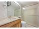 Modern bathroom with a glass shower door, light wood vanity, and updated sink at 1479 Nemrick Pl, Castle Rock, CO 80109