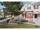 Inviting townhome with a well-manicured lawn and mature tree, perfect curb appeal at 1479 Nemrick Pl, Castle Rock, CO 80109