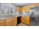 Kitchen with light wood cabinets and stainless steel appliances at 1479 Nemrick Pl, Castle Rock, CO 80109