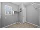 Bright laundry room with tile floors, a window, a shelf and hookups for a washer and dryer at 1479 Nemrick Pl, Castle Rock, CO 80109