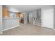 Open concept living room offers stairs leading to the second floor and an eat in kitchen at 1479 Nemrick Pl, Castle Rock, CO 80109