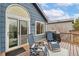 Outdoor deck area with seating, perfect for relaxing and entertaining guests at 6452 Freeport Dr, Highlands Ranch, CO 80130