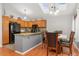 Well-equipped kitchen with modern appliances, ample counter space, and an adjacent dining area at 6452 Freeport Dr, Highlands Ranch, CO 80130
