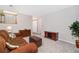 Comfortable living area with wood accents, plush seating, and neutral walls at 6452 Freeport Dr, Highlands Ranch, CO 80130