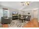 Comfortable living room with vaulted ceilings, a large window, and stylish decor at 6452 Freeport Dr, Highlands Ranch, CO 80130