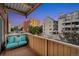 Relaxing balcony with comfortable seating and a colorful view of the surrounding buildings and neighborhood at 4110 Hale Parkway Pkwy # 3J, Denver, CO 80220