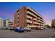 Brick apartment building featuring multiple balconies and convenient parking for residents at 4110 Hale Parkway Pkwy # 3J, Denver, CO 80220