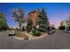 Well-maintained brick building with mature trees and landscaping in an urban setting at 4110 Hale Parkway Pkwy # 3J, Denver, CO 80220