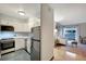Efficient kitchen features white cabinets, updated appliances, and connects to a bright living area at 4110 Hale Parkway Pkwy # 3J, Denver, CO 80220