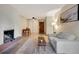 Cozy living room with brick fireplace, modern decor, and dining area at 4110 Hale Parkway Pkwy # 3J, Denver, CO 80220