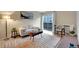 Bright living room featuring a sliding glass door to balcony and stylish decor on light wood floors at 4110 Hale Parkway Pkwy # 3J, Denver, CO 80220
