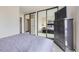 Bedroom featuring mirrored closet doors, a dresser with a TV, and access to a comfy double bed at 3260 47Th St # 108A, Boulder, CO 80301