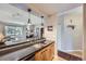 The kitchen features a breakfast bar that connects to a living room with fireplace and balcony at 3260 47Th St # 108A, Boulder, CO 80301