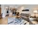 Open-concept living area flowing into a modern kitchen with breakfast bar and a cozy seating area at 3260 47Th St # 108A, Boulder, CO 80301