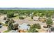 Aerial view of a quiet neighborhood with mature trees, homes, and a playground at 7780 S Kendall Blvd, Littleton, CO 80128