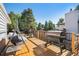 Back deck with a grill, smoker, and porch swing at 7780 S Kendall Blvd, Littleton, CO 80128