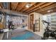 Basement gym featuring an exposed ceiling and gym equipment for a dedicated workout space at 7780 S Kendall Blvd, Littleton, CO 80128