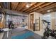 Basement gym featuring an exposed ceiling and gym equipment for a dedicated workout space at 7780 S Kendall Blvd, Littleton, CO 80128