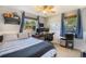 Bright bedroom with a dedicated workstation, filled with natural light from two windows at 7780 S Kendall Blvd, Littleton, CO 80128
