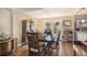 Traditional dining room featuring hardwood floors, french doors, and built-in china cabinet at 7780 S Kendall Blvd, Littleton, CO 80128