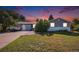 Charming single-story home with well-maintained lawn and driveway; perfect for Gathering living at 7780 S Kendall Blvd, Littleton, CO 80128