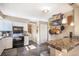 Functional kitchen with ample storage, granite countertops, and easy access to pantry at 7780 S Kendall Blvd, Littleton, CO 80128