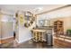 Open kitchen featuring granite countertops, functional layout, and eat-in dining area at 7780 S Kendall Blvd, Littleton, CO 80128