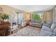 Spacious living room with a cozy atmosphere, featuring hardwood floors and a large window at 7780 S Kendall Blvd, Littleton, CO 80128
