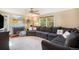 Comfortable living room with plush seating, a fireplace, and a view of the backyard at 7780 S Kendall Blvd, Littleton, CO 80128