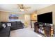 Cozy living room featuring plush seating, a large window, and neutral tones at 7780 S Kendall Blvd, Littleton, CO 80128